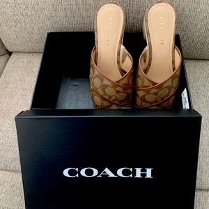 New with original box Coach brown and beige slide sandals. 1 1/2 inch heel